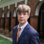 Headshot of Charles Burns posing on UVA's campus