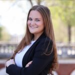 Headshot of Jane McGuiggan posing on UVA's grounds