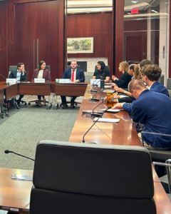 NSPC interns and CSBA staff sit around a large conference table
